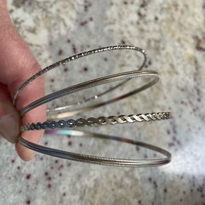 Set of 4 Silver Tone Mixed Style Bangle Bracelets